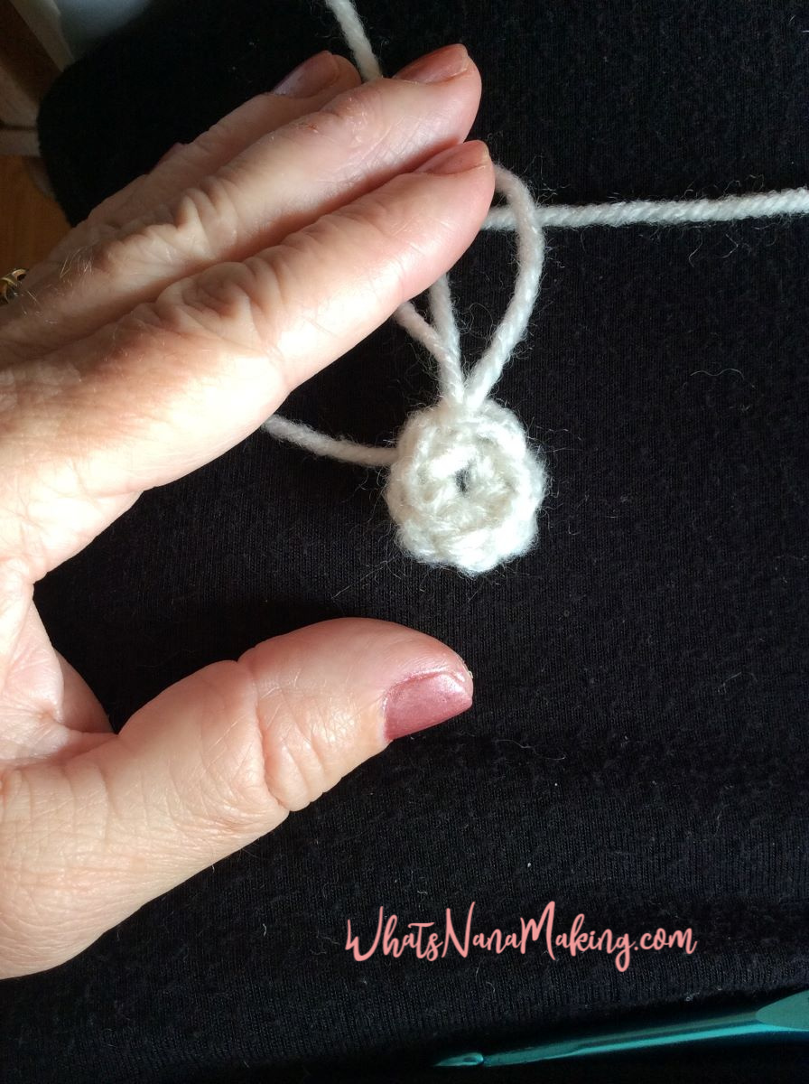 How to crochet a magic ring featured image. Picture depicts finished ring